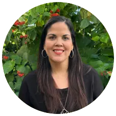 Kathleen Rodriguez, LMHC-S, smiling against a lush green background, representing Sunshine State Counseling Center's therapy team.